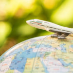 A Compelling Case Against Offshoring: Buying Overseas and the Impact on Your Business Tiny jet airplane on top of a globe.